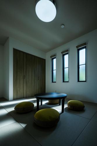 a room with a table and two pillows on the floor at Seaside Villa N - Vacation STAY 21989v in Mitsugoe