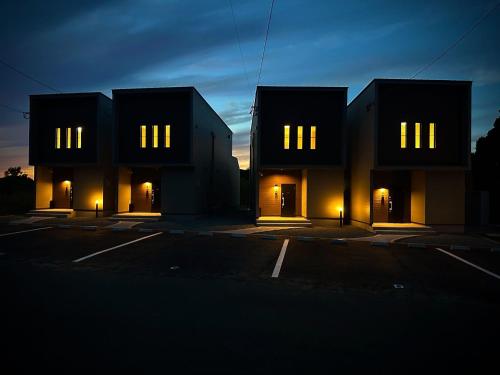 a building with lights on in a parking lot at Seaside Villa N - Vacation STAY 21989v in Mitsugoe