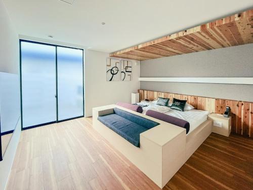 Ένα ή περισσότερα κρεβάτια σε δωμάτιο στο CORAL RESORT VILLA atsuhama - Vacation STAY 21217v