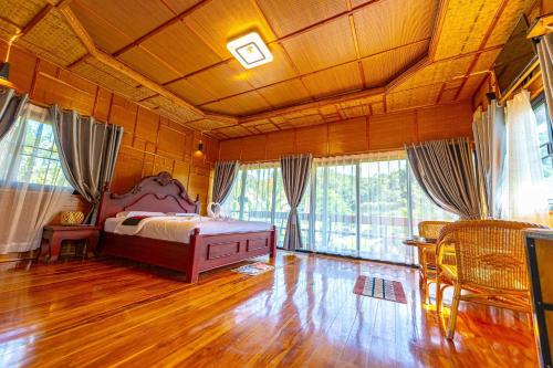Katil atau katil-katil dalam bilik di PhouPhet PhouKham Lodge