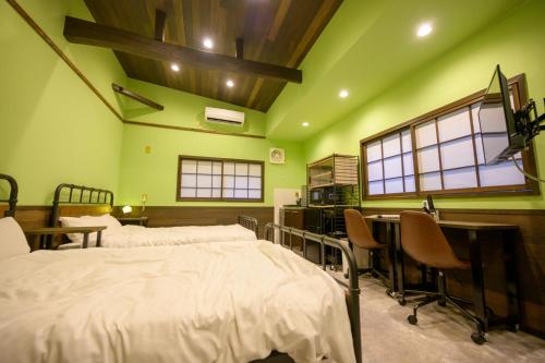 a hospital room with two beds and a desk at Hyuga Surf Camp102 - Vacation STAY 31830v in Hyuga