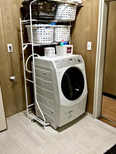 a washing machine on a rack in a room at Tokami House - Vacation STAY 21218v in Yasugi