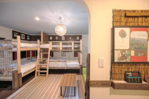 a room with two bunk beds and a hallway at Hyuga Surf Camp 212 - Vacation STAY 35446v in Hyuga