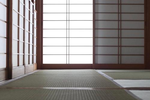 an empty room with a door and windows at Dekopin House - Vacation STAY 18550 in Hanamaki