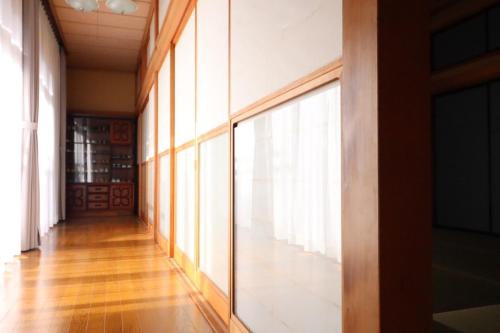 a hallway with a large window in a building at Dekopin House - Vacation STAY 18550 in Hanamaki
