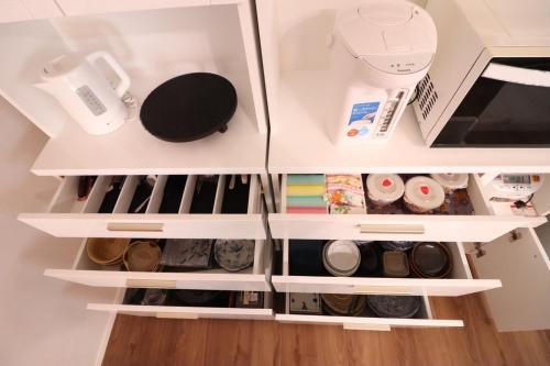 a refrigerator filled with lots of food and drinks at Dekopin House - Vacation STAY 18550 in Hanamaki