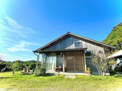 a small house on a grassy field in front at Gubo Satoyama Suite Lodge & Camp - Vacation STAY 39503v in Katsuura