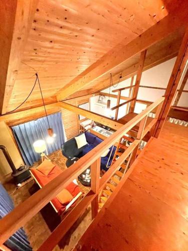 an overhead view of a living room in a wooden cabin at Gubo Satoyama Suite Lodge & Camp - Vacation STAY 39504v in Katsuura