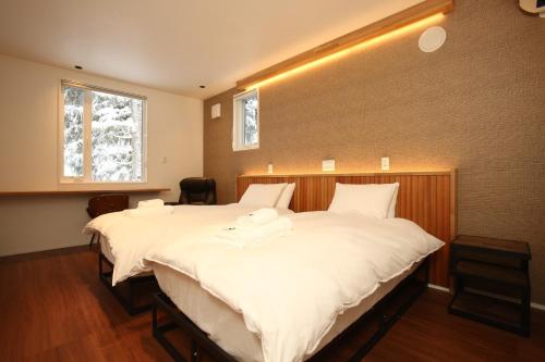 Postel nebo postele na pokoji v ubytování Alpine Tenshi Villas - Vacation STAY 61169v