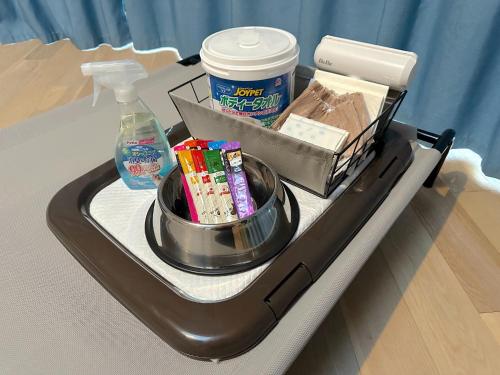 a tray on a hospital bed with food and drinks at Hagi Matsusue Outdoor Village - Vacation STAY 39513v in Asakura
