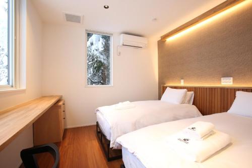 Postel nebo postele na pokoji v ubytování Alpine Tenshi Villas - Vacation STAY 61121v