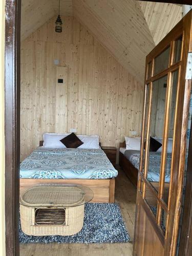 Ένα ή περισσότερα κρεβάτια σε δωμάτιο στο Kaushi Homestay