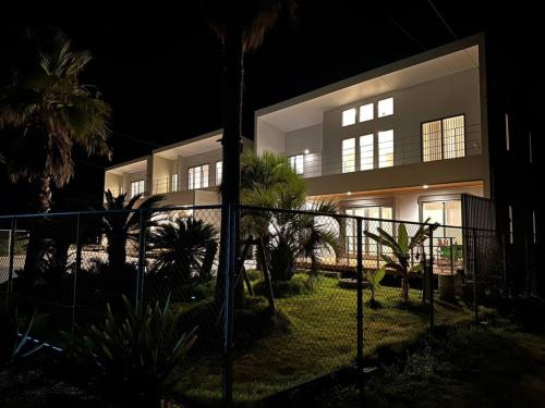 a large house at night with lights on at Shirahama Village - Vacation STAY 52778v in Minamiboso