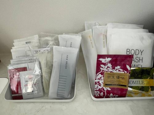two plastic containers filled with products on a table at Shirahama Village - Vacation STAY 52778v in Minamiboso