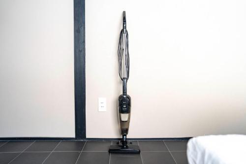a hair dryer hanging from a wall in a room at AKATSUKI - Vacation STAY 18831 in Kami-furano