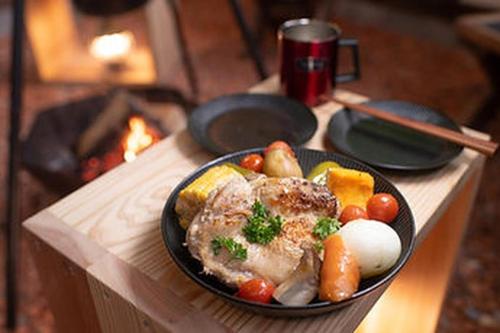 a plate of food with meat and vegetables on a table at Camping-style accommodation: Yumeraku - Vacation STAY 65716v in Ema
