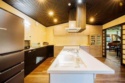a large kitchen with a sink and a counter at Miyagizaoboshikan Hikoboshikan - Vacation STAY 70279v in To-katta