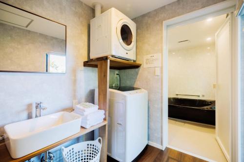 a small bathroom with a sink and a microwave at Villa Zao - Vacation STAY 73045v in To-katta