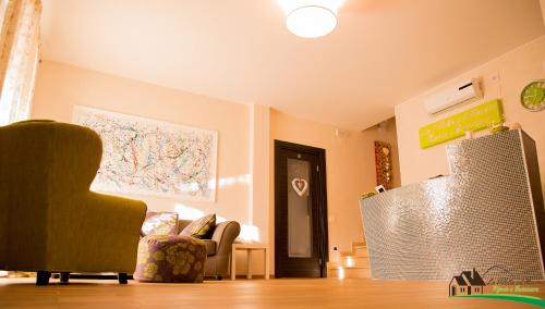 a living room with a chair and a map on the wall at La Villetta Sul Mavone in Colledara