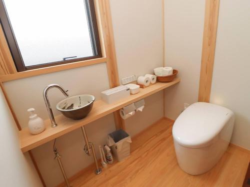 a bathroom with a toilet and a sink at A-UN INN - Vacation STAY 84863v in Aizuwakamatsu