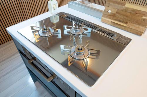 a kitchen counter with two burners on a stove at Bridge View Villa - Vacation STAY 80945v in Awaji