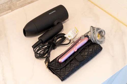 a hair dryer and a purse on a counter at Bridge View Villa - Vacation STAY 80945v in Awaji