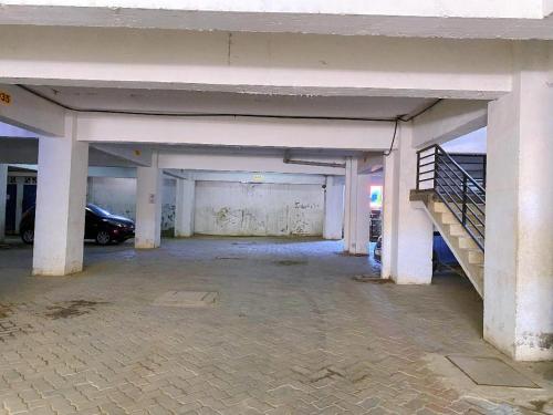 an empty parking garage with a car parked in it at kisimani Nest in Mombasa