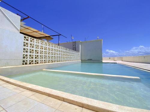 a swimming pool on the roof of a building at kisimani Nest in Mombasa
