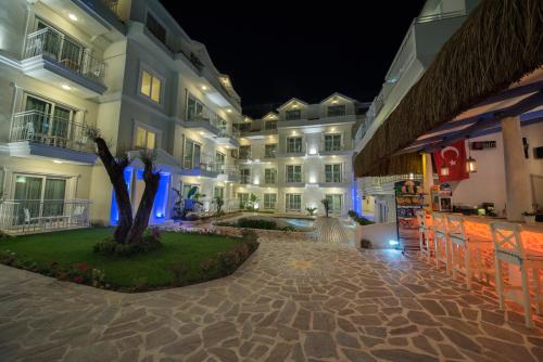 a view of a hotel at night at Montebello Deluxe Hotel in Oludeniz