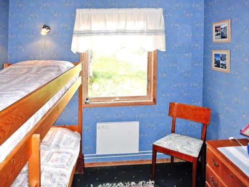 Ένα ή περισσότερα κρεβάτια σε δωμάτιο στο 4 person holiday home in HENÅN-By Traum