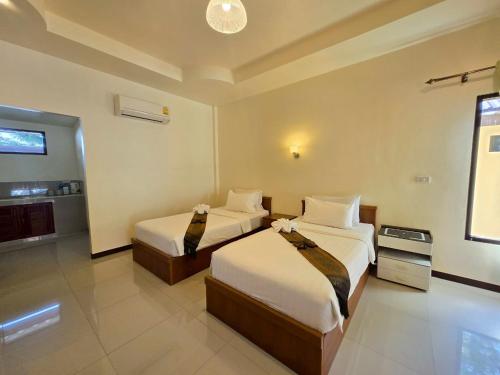 เตียงในห้องที่ OYA International Resort Phuket 普吉岛欧雅国际度假酒店