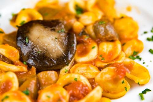 a plate of food with pasta and meat at Agriturismo Fasano in Cassano delle Murge