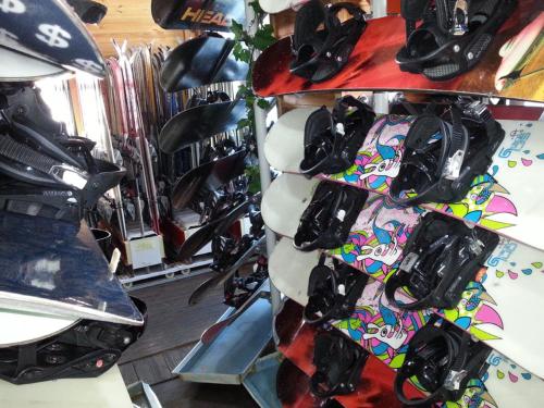 a group of snowboards on a rack in a store at White Cabin in Pyeongchang 