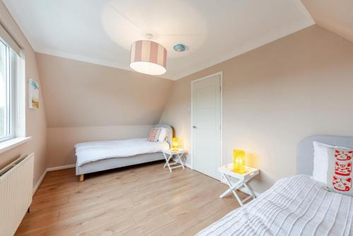 Postel nebo postele na pokoji v ubytování Pett Level Beach House