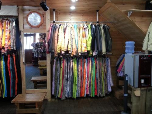 a store with a bunch of different colored ties at White Cabin in Pyeongchang 