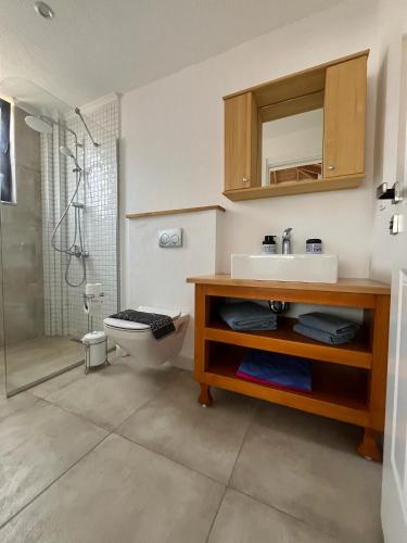 a bathroom with a sink and a toilet and a shower at Derya Beach Agullu Villa 6 in Kaş
