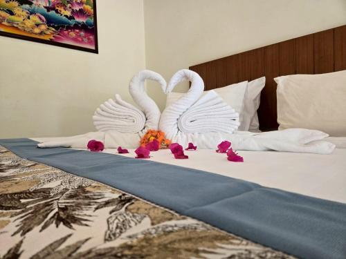 เตียงในห้องที่ OYA International Resort Phuket 普吉岛欧雅国际度假酒店