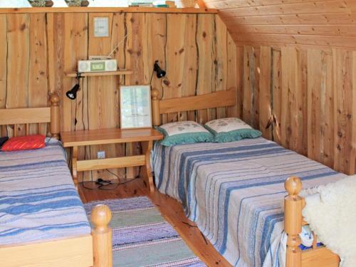 Ένα ή περισσότερα κρεβάτια σε δωμάτιο στο Scenic Lakeside Cottage-By Traum