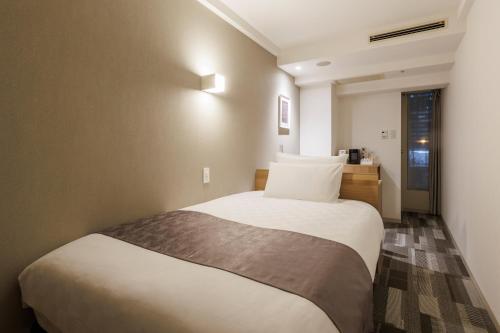 a bedroom with a large bed in a room at Shinagawa Prince Hotel East Tower in Tokyo