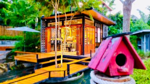a model of a small house on the water at Heaven Hill Camping in Ban Thung Na