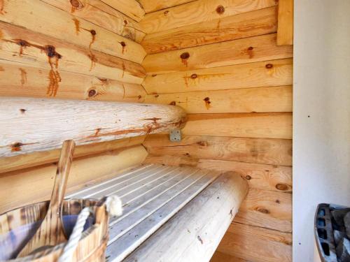 a log cabin with a bed in the corner at 6 person holiday home in SÄLEN-By Traum in Tandådalen