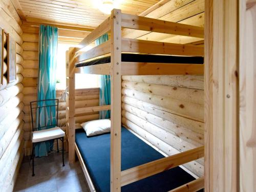 a bedroom with bunk beds in a cabin at 6 person holiday home in SÄLEN-By Traum in Tandådalen