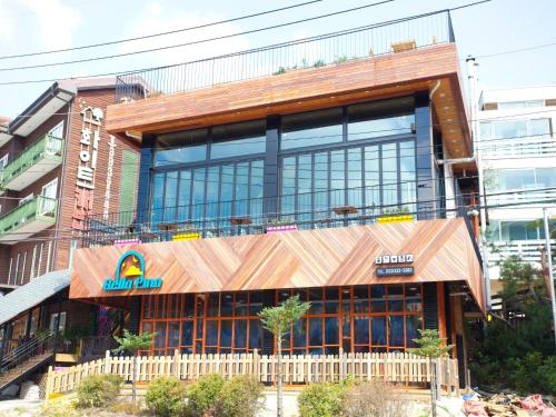 a building with a sign on the front of it at White Cabin in Pyeongchang 