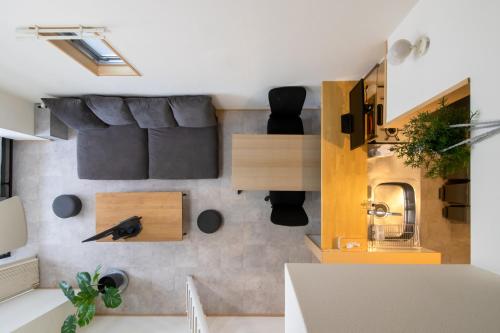 a small apartment with a sink and a mirror at STAIRS Hotel 402 in Fukuoka