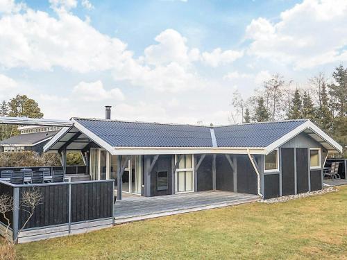 a house with a solarium and a deck at Tranquil Oasis near Golf Course-By Traum in Hals