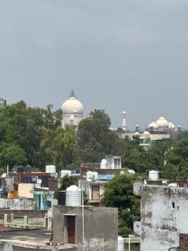 a view of a city with buildings and mosques at Friends Guest House & Hostel- near TAJ MAHAL in Agra