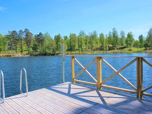 a wooden dock on a body of water at 4 person holiday home in AXVALL in Axvall