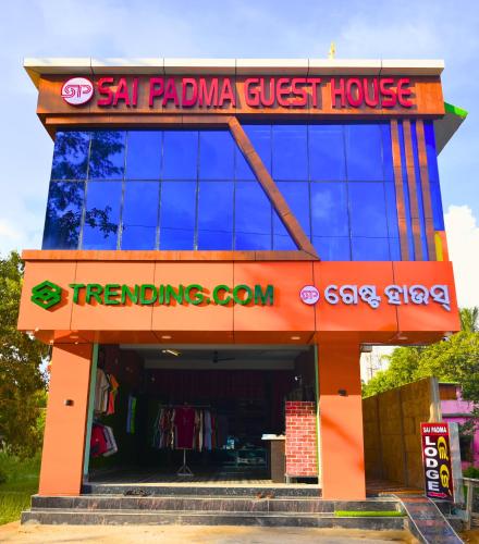 a store with a sign that readsla pajama guest house at Sai Padma Guest House in Konārka