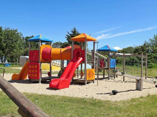 a playground with a slide in a park at 7 person holiday home in Struer-By Traum in Humlum