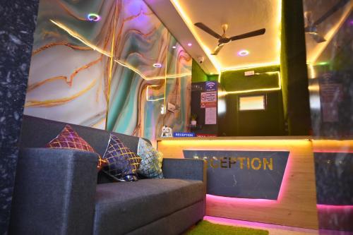a train car with a couch in a room at Sai Padma Guest House in Konārka